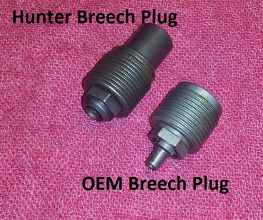 Original breech plug next to 209 breech plug